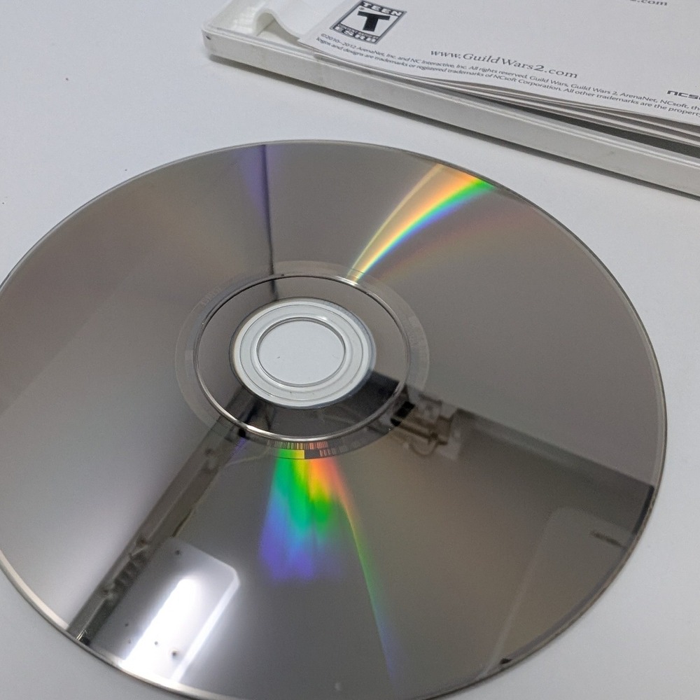 Guild Wars 2 PC Game DVD-ROM ArenaNet 2-Disc Set with Manual and Serial Code - Picture 10 of 11